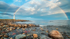 A spectacular scene with a lighthouse on a rocky coast with a beautiful rainbow in the background. The rainbow stretches across the entire frame, stretching from left to right, creating a stunning natural scene. The lighthouse seems to stand on a rock near the water's edge, giving a sense of solitude and guidance. The rocks in the foreground add texture and contrast to this image, emphasizing the natural features of the coastline.ar16∶9，v6